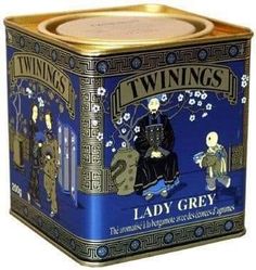 a tin can with an image of lady grey on it's front and sides