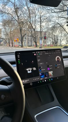 the dashboard of a car with an electronic device on it