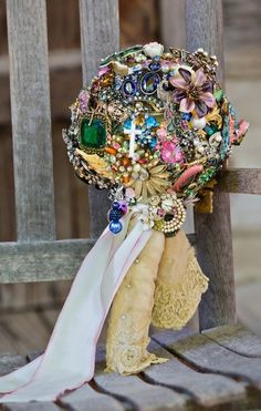 a bridal bouquet sitting on top of a wooden bench