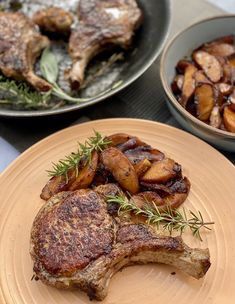 two plates with meat and potatoes on them, one has been cooked in the oven