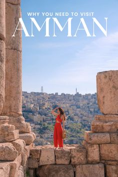 a woman standing on top of a stone structure with the words why you need to visit aman