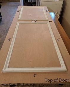 an unfinished cabinet door is shown with measurements