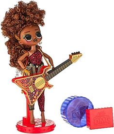 a doll with an electric guitar next to it