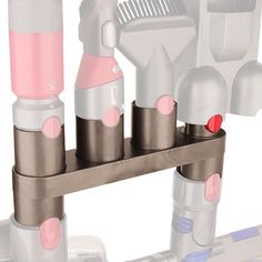 the toothbrush holder is attached to the wall with three bottles in front of it