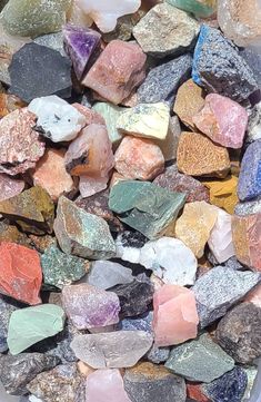 many different colored rocks in a bowl