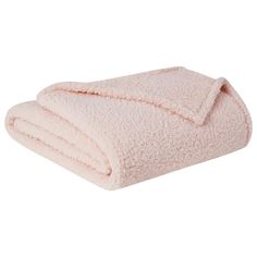 a pink blanket folded on top of each other