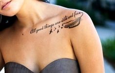 a woman with a tattoo on her chest that says, all good things are wild and free