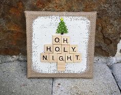 a wooden scrabble tile with a christmas tree on it and the words oh, holly night