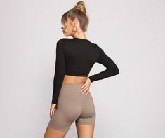 This crop top brings all the hype for your outfit. The crop top features a round neckline. fitted long sleeves. and a cropped hem. Complete your look with high waist biker shorts and chunky sneakers.Fit & Features Round neckline Fitted long sleeves Cropped hem Smooth knit fabric Form hugging fit Model is 5'9" with a 32" bust. 24" waist and 34" hips. She is wearing a size small. Homecoming Outfits, Workout Crop Top, The Hype, Selling Clothes, Chunky Sneakers, White Crop Top, Biker Shorts, Black Crop Tops, Round Neckline