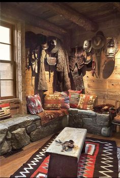 a living room filled with lots of furniture and pillows