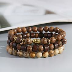 Product Description： Condition： 100% new and high quality Material： Metal+Wooden Beads+Narural Stone Color： As the picture shown Bracelet Size：(approx) 6.5"-7.5" (Elastic) Bead Size：(Approx) 8mm Package Included： 3 Pcs Bracelets    Feature： ❀ The unique and innovative designs are handcrafted and produced with the finest care. ❀ For gift-giving occasions: tourism memorial, birthday, wedding, advertising promotions, business gifts, holiday, after the trade fair. ❀ It's a perfect accessory, also a good gift to your friends It will make you beautiful on picture. Suitable for any season. ❀ You will receive similar items, as shown in the picture, not exactly the same, because natural stones are unique. ❀ When not wearing it, it is recommended to store the jewelry in a zipper pouch (air-tight bag Stone Beaded Bracelets, Prayer Jewelry, 7 Chakra Bracelet, Wooden Beaded Bracelets, Crown Bracelet, Macrame Beads, Wood Bead Bracelet, King Crown, Turquoise Bead Bracelet