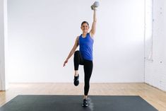 a woman is doing an exercise on a mat