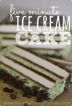 a piece of ice cream cake sitting on top of a wooden cutting board