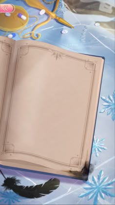 an open book sitting on top of a table covered in snowflakes and paper