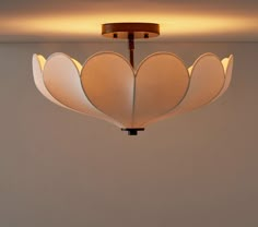 a light fixture hanging from the ceiling in a room