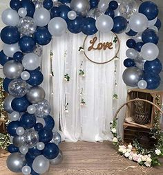 blue and silver balloon arch with love sign