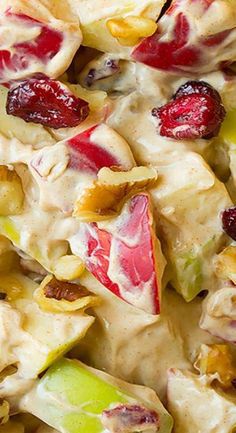 a salad with apples, cranberries and nuts