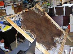 a large piece of wood sitting on top of a wooden table next to other pieces of furniture