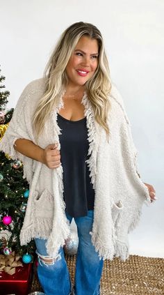 This item is in stock and ready for shipment! Its also available for local pick up in Magnolia, TX. Spend more than $99 dollars and shipping is on me! This fringe shawl is to die for! Fabric is similar feel to Barefoot Dreams. Features feathery fringe trim and pockets. Side are open arm holes. FABRIC: 100% Polyester MODEL 5'6 Size 6- Wearing OS MODEL 5'6 Size 16/18 - Wearing OS Shawl With Pockets, Fringe Shawl, Fringe Kimono, Boho Layering, Unique Sweaters, Kimono Wrap, Linen Sweater, Argyle Sweater, Purple Sweater