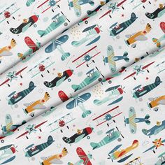 an airplane and plane pattern on white fabric