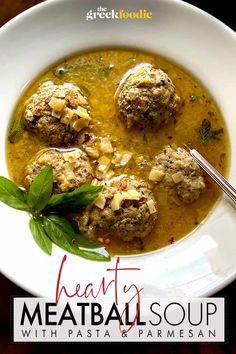 meatball soup with pasta and parmesan in a white bowl