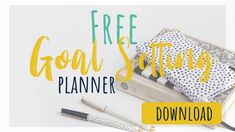 the free goal setting planner is shown with pens, notebooks and other items on it