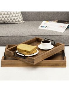 a tray that has some bread on it and a cup of coffee in the middle