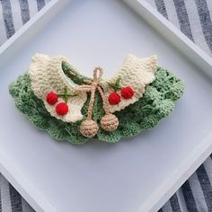 a crocheted christmas decoration on a plate