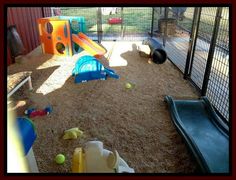 an indoor play area with toys and other items in the caged area for children to play