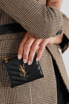 SAINT LAURENT's 'Monogramme' wallet has been made in Italy from glossy textured-leather and neatly quilted into chevrons. It's punctuated by a gleaming gold 'YSL' plaque - which is nothing short of iconic in the industry - and has a zipped coin pocket, plus space for bills.  Wear it with: [SAINT LAURENT Shoulder bag id1293748], [SAINT LAURENT Blazer id1265071], [SAINT LAURENT Tank id1265093], [SAINT LAURENT Pants id1265081]. Saint Laurent Pants, Saint Laurent Blazer, Ysl Wallet, Summer Style Guide, Bag Obsession, Stylish Purse, Luxury Wallet, Girly Accessories, Designer Wallets