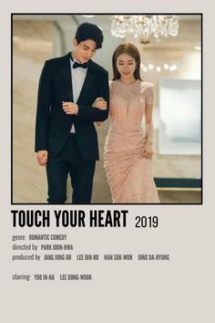 a man and woman standing next to each other in front of a poster with the words touch your heart