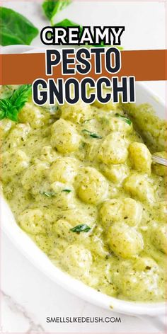 creamy pesto gnocchini in a white bowl