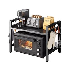 a toaster oven sitting on top of a table with bread and coffee in it