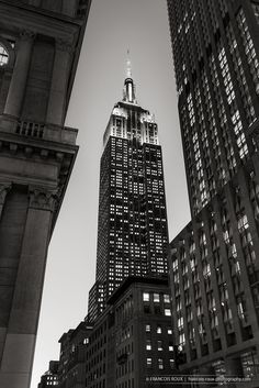 black and white photograph of the empire building in new york city, ny at night