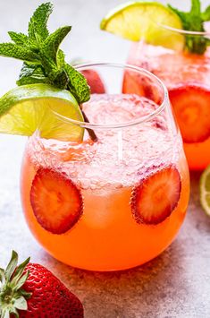 two glasses filled with strawberry lime vodka and garnish