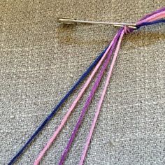 a pair of knitting needles sitting on top of a table