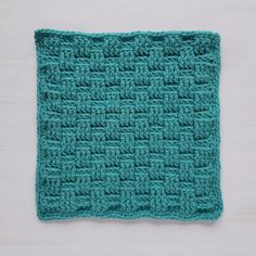 a crocheted dishcloth on a white surface