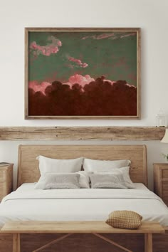 a bedroom with a large painting above the bed