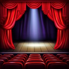 an empty theater stage with red curtains