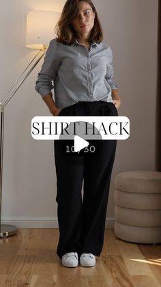 a woman standing in front of a lamp with her hands on her hips and the words shirt back