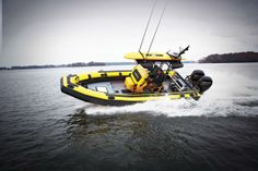 a yellow and black boat in the water