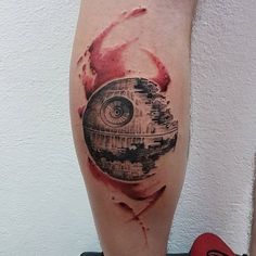 a star wars themed tattoo on the leg