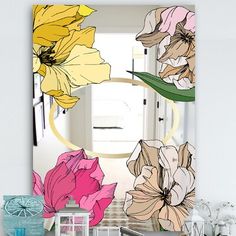 a mirror with flowers painted on it in a room