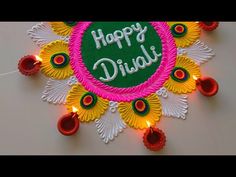 happy diwali greeting card with colorful flowers and lights on white surface, closeup