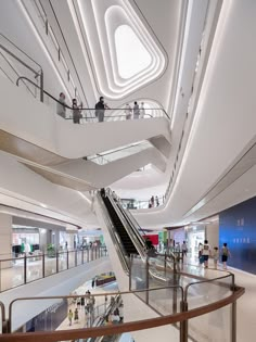 an escalator in a building with people on it