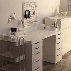 a white desk with lots of drawers in a room