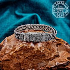 Introducing our exquisite Viking Bracelet, a stunning piece crafted from sterling silver, with delicate and intricate weaving reminiscent of the Viking era.    * The difference between the bracelets is only in width and weight. * Small Viking Bracelet:   Material: 925 Sterling Silver   Weight  approx. 43 grams (1,51 oz)   Weight depends on bracelet length   Width of the box 10 mm * Medium Viking Bracelet:   Material: 925 Sterling Silver   Weight  approx. 90 grams (3,17 oz)   Weight depends on br Norse Bracelet, Mammen Style, Viking Ornament, Viking Arm Rings, Norse People, Arm Ring, Vine Tattoos, Viking Culture, Bracelet Viking