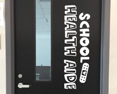 a black door with white lettering on it and the words school are written in large letters