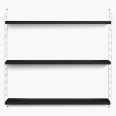 three black shelves with white metal brackets on each shelf and one is hanging off the wall