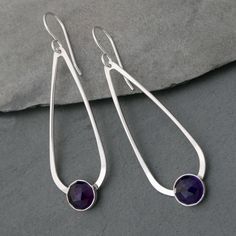 Teardrop Amethyst Earrings 8mm rose cut purple amethysts are set in sterling silver on handmade sterling silver teardrops.   The teardrops swing from solid sterling silver ear wires. These earrings are 2 1/4 inches long including the ear wires.   5/8 inches at the widest part of the teardrop.   Deep purple faceted amethyst sparkles in the light. For more earrings: https://www.etsy.com/shop/KiraFerrer?section_id=7937255&ref=shopsection_leftnav_3 For more Teardrop gemstone earrings: https://www.et Earrings Round, Amethyst Earrings, Earrings Etsy, Earrings Sterling Silver, Handmade Sterling Silver, Minimalist Earrings, Jewelry Tutorials, Purple Amethyst, Teardrop Earrings